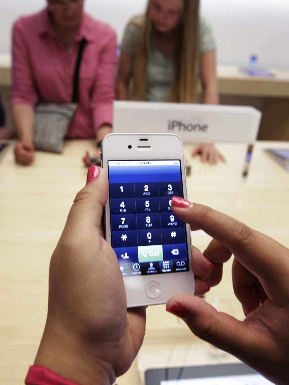 Apple reported lower-than-expected third-quarter revenues, numbers partly blamed on slower iPhone sales.