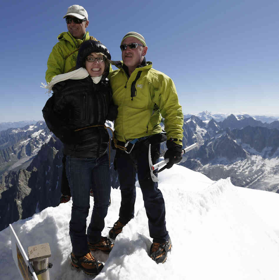 Former Rep. Gabrielle Giffords (center) and her husband Mark Kelly (right), at the peak of Aiguille du Midi in the French Alps on Monday. Behind them is mountain guide Vincent Lameyre.