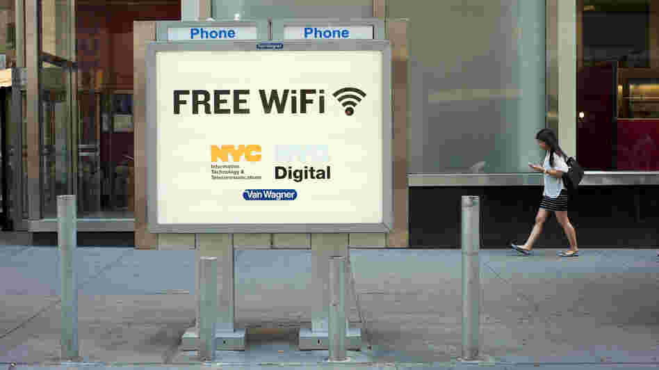 A phone booth serves as a free Wi-Fi hot spot in New York City's Columbus Circle.
