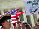 Susan Clark argues with  another protester about the Affordable Care Act outside the U.S. Supreme Court.