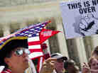 Susan Clark argues with  another protester about the Affordable Care Act outside the U.S. Supreme Court.