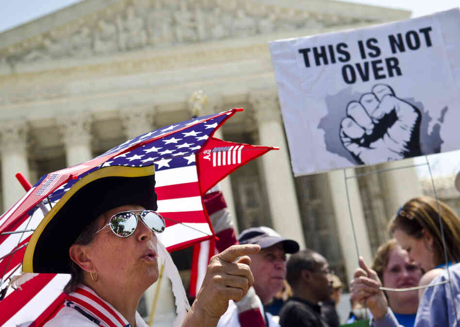Susan Clark argues with  another protester about the Affordable Care Act outside the U.S. Supreme Court.