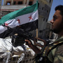 A Free Syrian Army solider mans a checkpoint in the northern town of Ariha, on the outskirts of Idlib, Syria, last month. In rural areas held by rebels, new institutions are cropping up to fill the void left by the receding Syrian state.