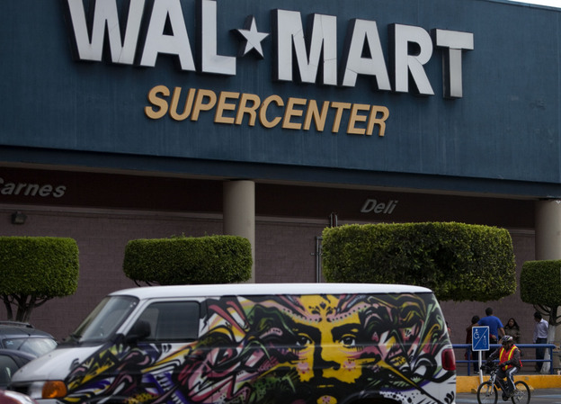 A van covered by a mural sits parked outside a Walt-Mart Super Center in Mexico City.