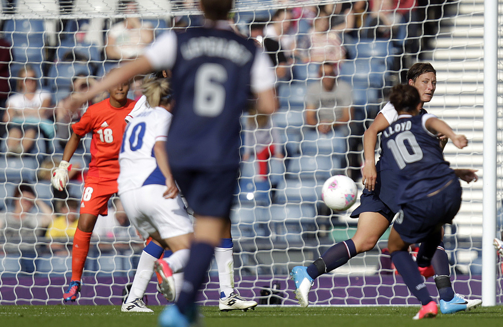Carli Lloyd scores the U.S. team's winning goal, in a comeback win over France. The Americans are bidding for their third straight Olympic gold medal.