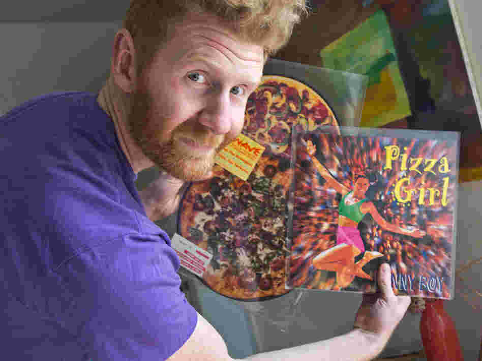Brian Dwyer owns the world's largest collection of pizza-related items. He plans to display some of his memorabilia, including pizza-themed music records, in a new museum-restaurant in Philadelphia.