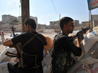 Tuesday in Aleppo, these men from an anti-Assad force were on guard at a checkpoint. Tuesday in Aleppo, these men from an anti-Assad force were on guard at a checkpoint.