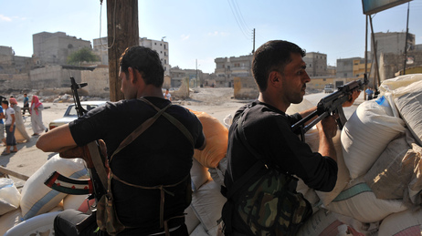 Tuesday in Aleppo, these men from an anti-Assad force were on guard at a checkpoint. Tuesday in Aleppo, these men from an anti-Assad force were on guard at a checkpoint.