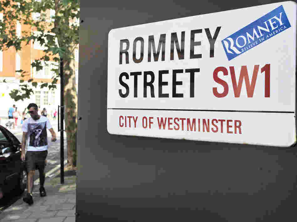 A campaign sticker for Republican presidential candidate Mitt Romney is seen on a sign for Romney Street in London on Wednesday, as Romney arrived to meet with leaders, hold fundraisers and attend the opening of the Olympics.