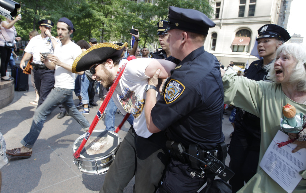 An Occupy Wall Street protestor is arrested in Zuccotti Park July 11, 2012, in New York.