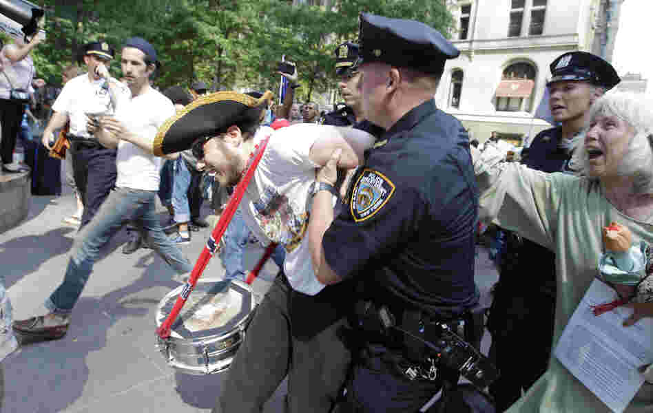 An Occupy Wall Street protestor is arrested in Zuccotti Park July 11, 2012, in New York.