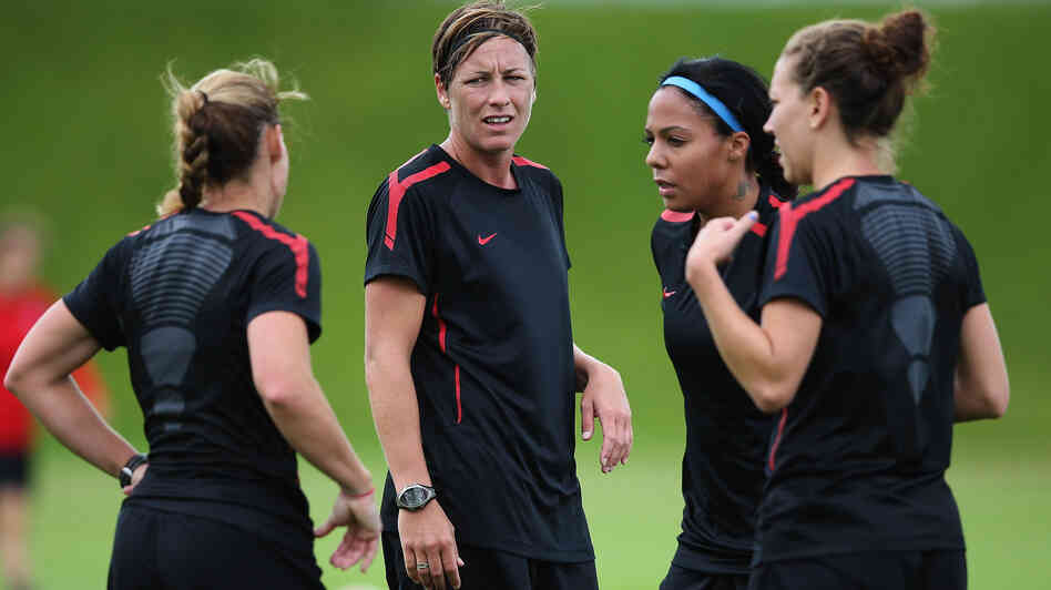 Abby Wambach (center) and other members of the U.S. women's Olympic soccer team train in Glasgow. The Americans will begin the Olympics with a match against France in Scotland Wednesday.
