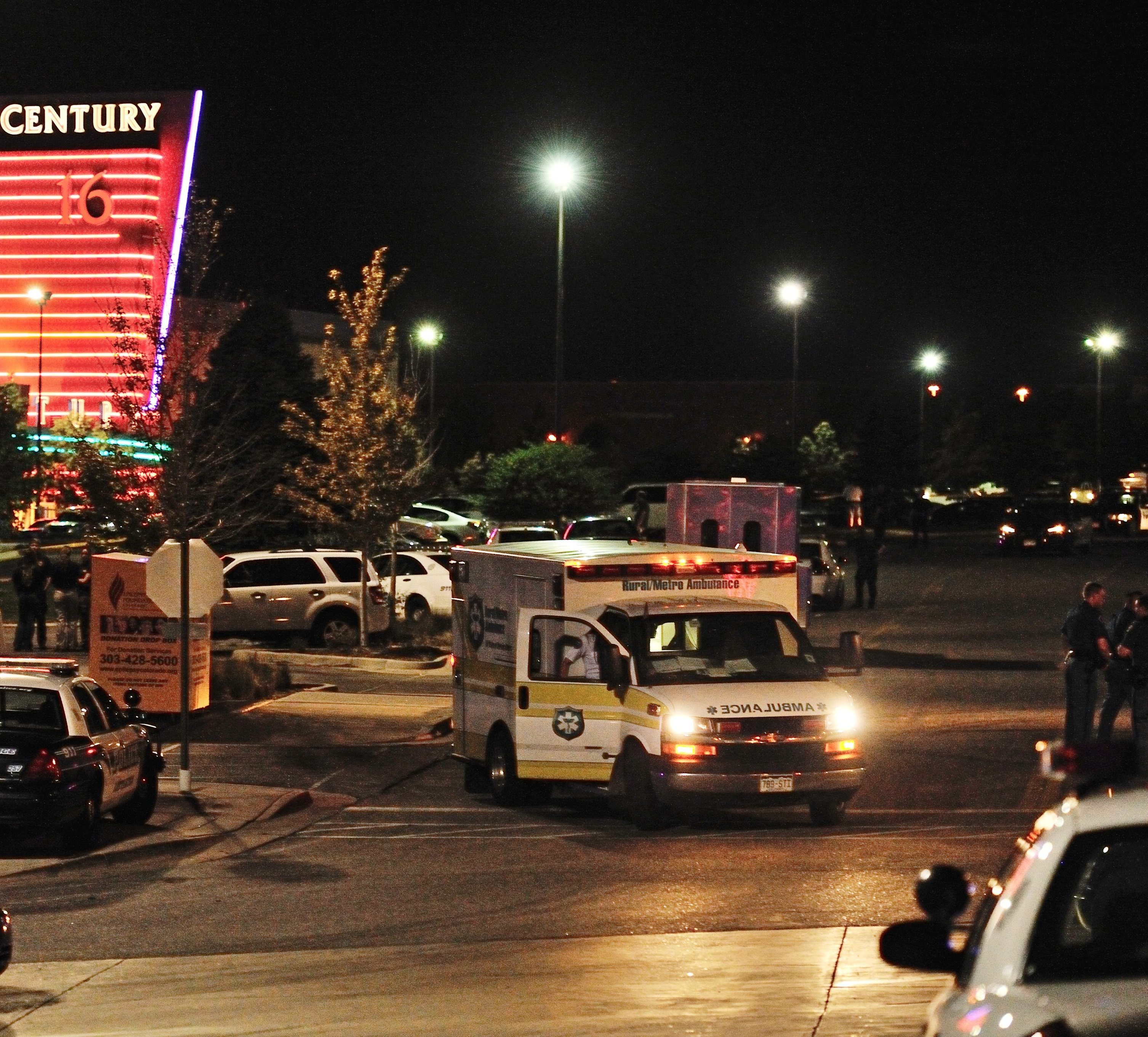 An ambulance and police cars outside the Century 16 movie theater complex in Aurora, Colo, during the early hours of July 20, 2012. A gunman attacked an audience there — killing 12 people and wounding 58.