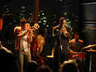 Christian Scott (left, playing himself) and Rob Brown (playing Delmond Lambreaux) perform at Jazz at Lincoln Center in the program Treme.