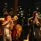 Christian Scott (left, playing himself) and Rob Brown (playing Delmond Lambreaux) perform at Jazz at Lincoln Center in the program Treme. Christian Scott (left, playing himself) and Rob Brown (playing Delmond Lambreaux) perform at Jazz at Lincoln Center in the program Treme.
