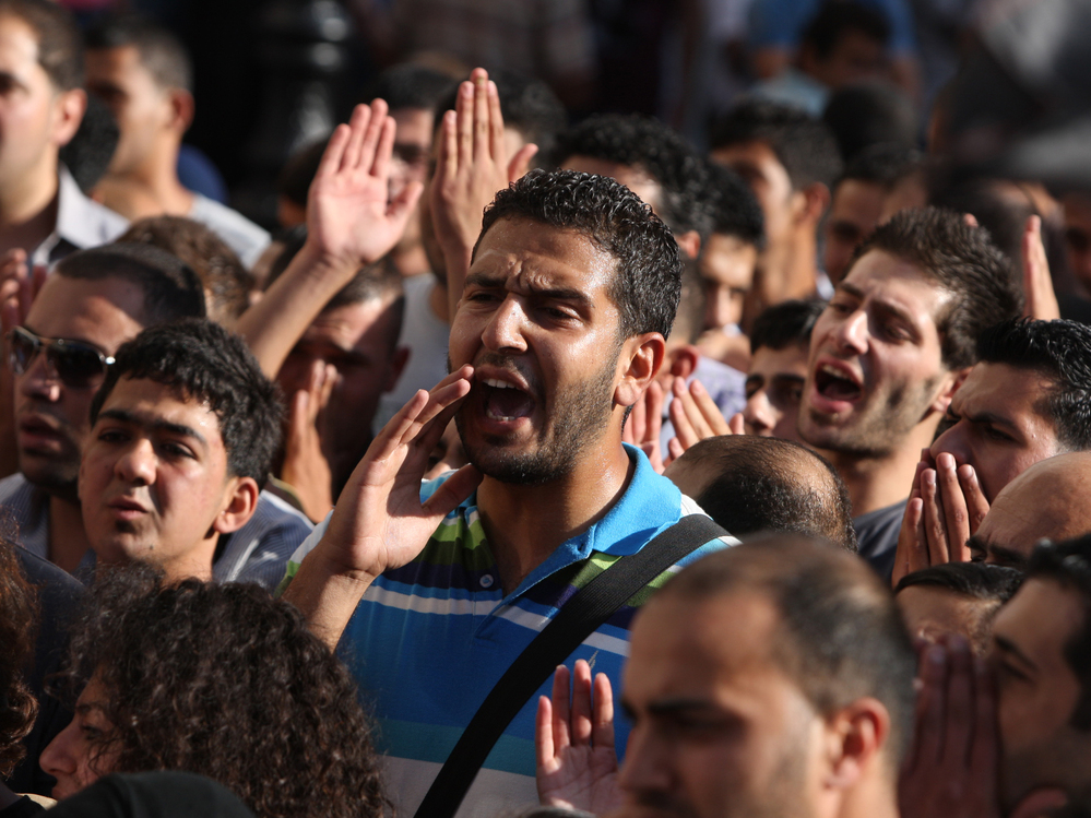 Palestinian demonstrators chant slogans in the West Bank city of Ramallah last month during a protest against a meeting between Abbas and Israel's deputy prime minister.