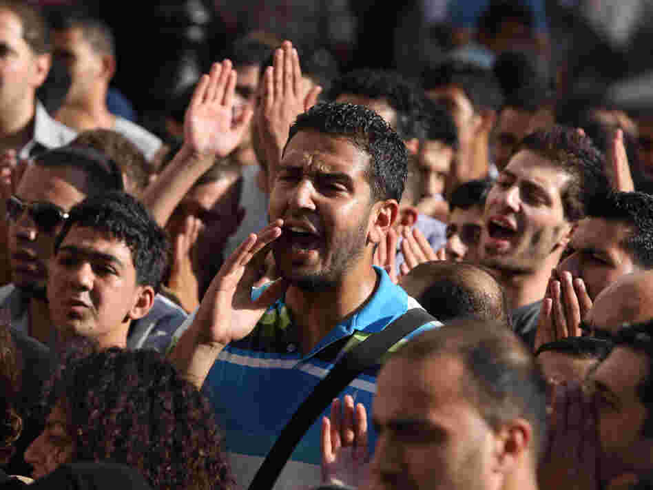 Palestinian demonstrators chant slogans in the West Bank city of Ramallah last month during a protest against a meeting between Abbas and Israel's deputy prime minister.