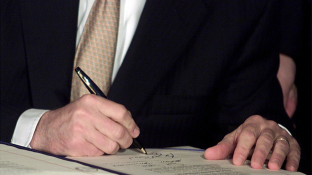 President George W. Bush signs tax cut legislation on June 7, 2001. The cuts from this and a subsequent bill are set to expire at the end of 2012.