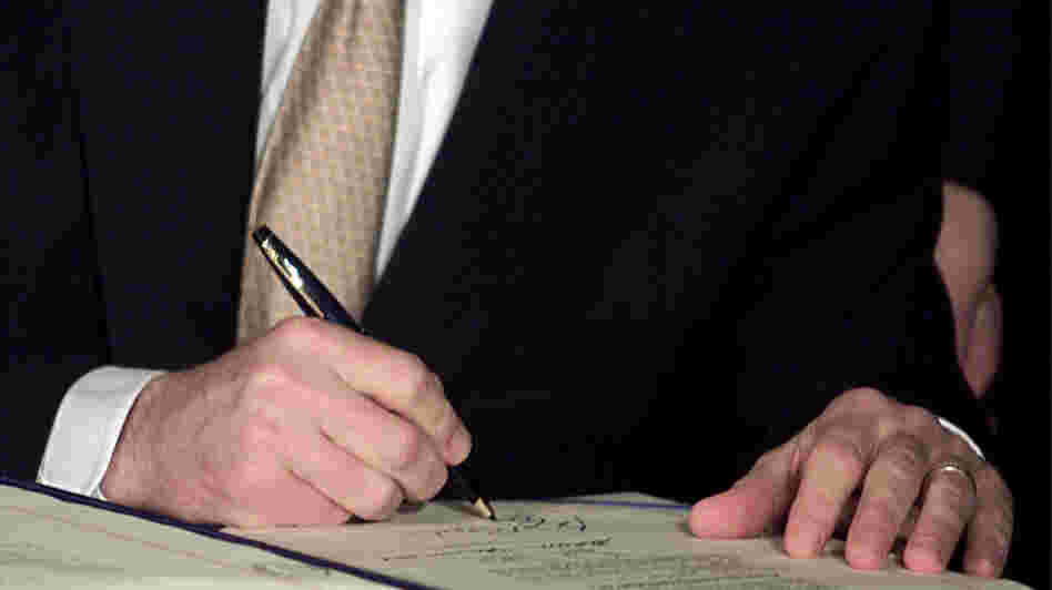 President George W. Bush signs tax cut legislation on June 7, 2001. The cuts from this and a subsequent bill are set to expire at the end of 2012.