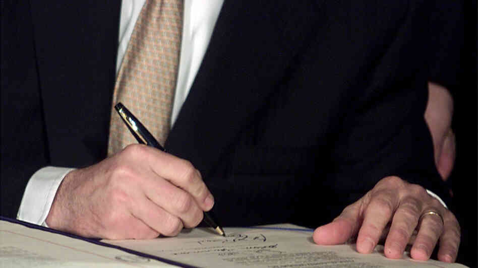 President George W. Bush signs tax cut legislation on June 7, 2001. The cuts from this and a subsequent bill are set to expire at the end of 2012.