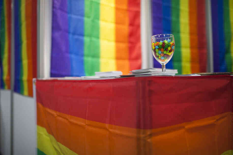 Colorful flags and candies decorate the LGBT Networking Zone. More than 120 groups from around the world set up booths in the Global Village to distribute information about the AIDS epidemic.