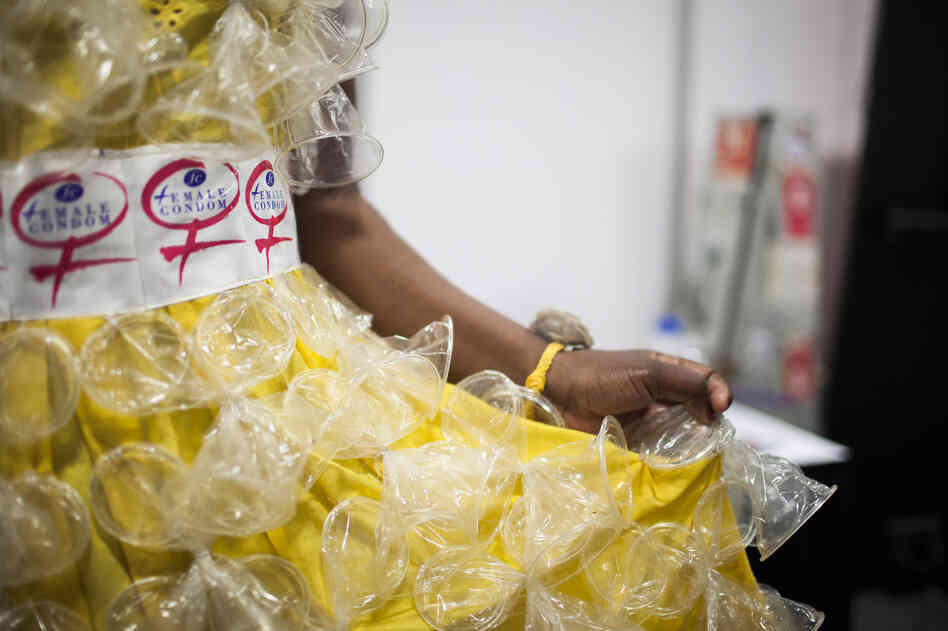 A fashion show on Tuesday evening featured dresses decorated with female condoms. Here Olwin Manyanye from Zimbabwe prepared backstage for the show, which raised awareness for the growing need of female condoms.