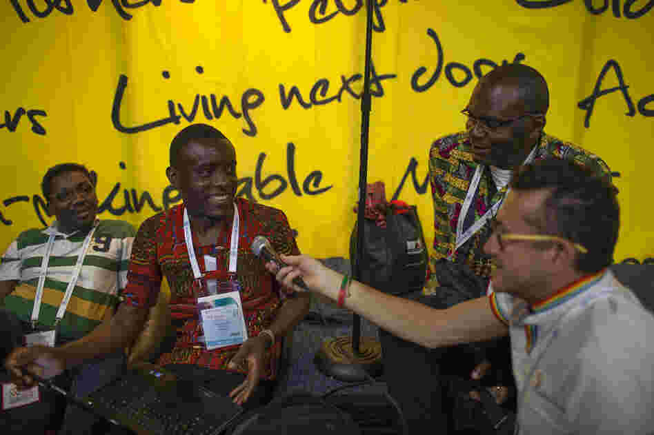 At a booth dedicated to people living with HIV, Michel Bourrelly from France handed the mic to Roger Yves from Cameroon to lead the group in an African song on Thursday afternoon.