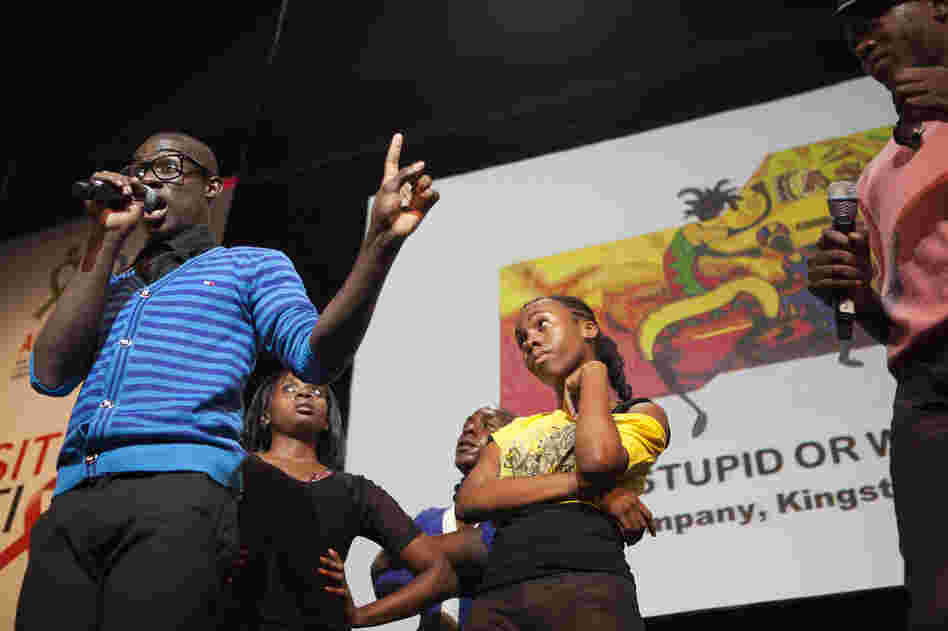 Safe, Stupid or What? The Ashe Performing Arts Company, based in Kingston, Jamaica, performed a musical television game on Thursday in the Global Village. The show used song and dance to explain how HIV is transmitted.