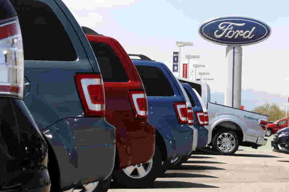 Ford Escapes sit at a Ford dealership in east Denver.