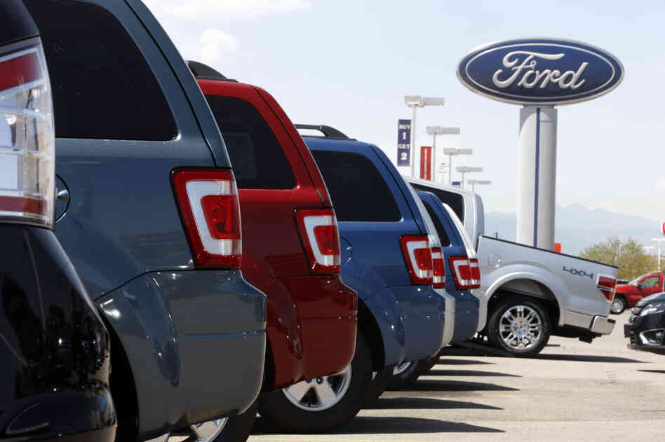 Ford Escapes sit at a Ford dealership in east Denver.