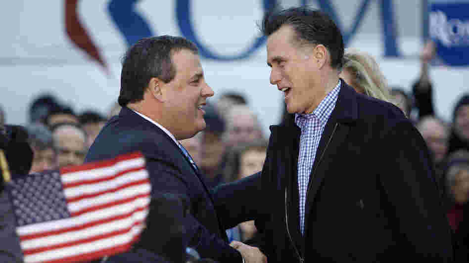 New Jersey Gov. Chris Christie greets Republican presidential candidate Mitt Romney in Des Moines, Iowa, on Dec. 30, 2011.