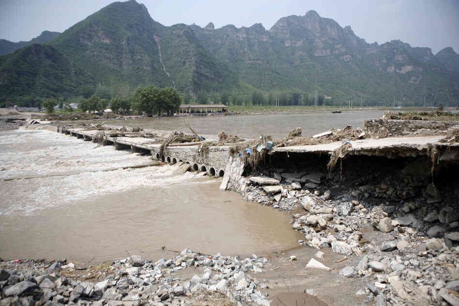 A bridge leading to the town of Laishui, north of Beijing, collapsed on Tuesday.