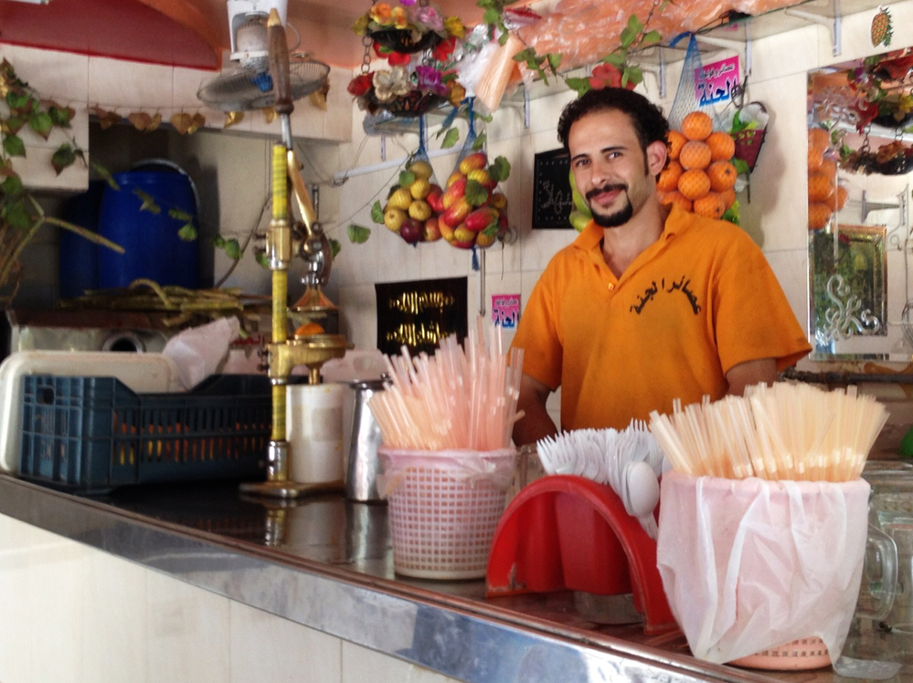 Mohamed Godb works at Paradise Juices in a Cairo suburb. One way Egyptians are trying to beat the heat this Ramadan season is breaking the fast by drinking fresh juice.