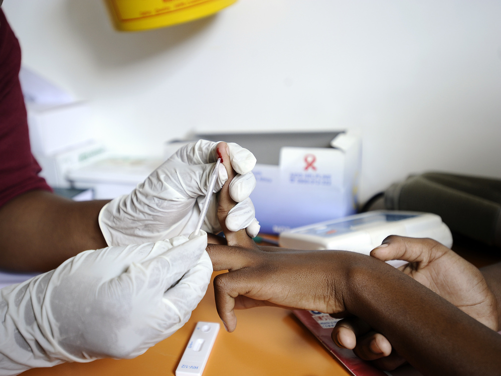 A drop of blood from a finger-prick is all that's needed to test for HIV. A nurse draws a sample from a student in a mobile clinic on March 8, 2011 in KwaZulu-Natal, South Africa.