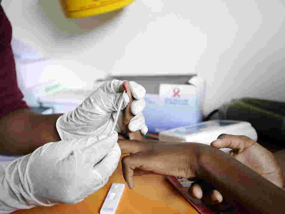A drop of blood from a finger-prick is all that's needed to test for HIV. A nurse draws a sample from a student in a mobile clinic on March 8, 2011 in KwaZulu-Natal, South Africa.