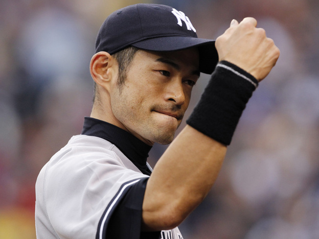 New York Yankees right fielder Ichiro Suzuki readies for a fist bump ... or a fist pump for his new song?