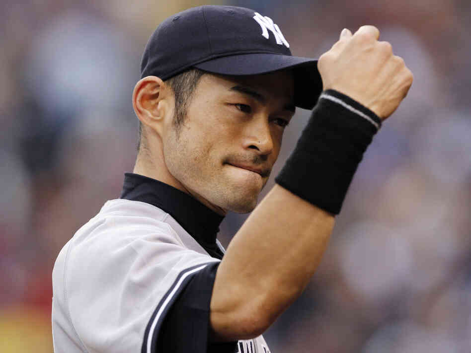 New York Yankees right fielder Ichiro Suzuki readies for a fist bump ... or a fist pump for his new song?