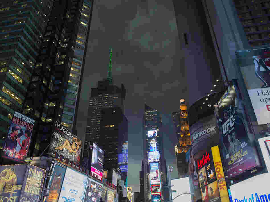 Storm clouds loom over Times Square as Manhattan braced for heavy weather Thursday in New York. Storm clouds loom over Times Square as Manhattan braced for heavy weather Thursday in New York.