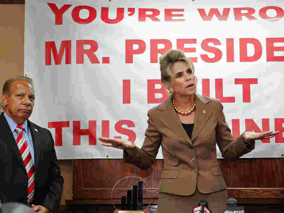 Rebecca Smith, owner of A.D. Morgan, speaks Thursday at a Tampa, Fla., event to denounce President Obama's statements about small businesses. The event was organized by the Romney campaign. At left is Lou Ramos of Value Enterprise Solutions.