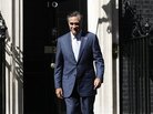 Mitt Romney leaves London's 10 Downing Street after meeting with British Prime Minister David Cameron. Mitt Romney leaves London's 10 Downing Street after meeting with British Prime Minister David Cameron.