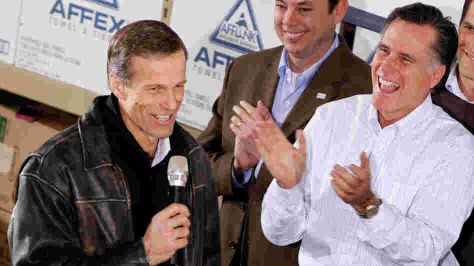 Mitt Romney gets a kick out of South Dakota Sen. John Thune's comments during a January rally in Dubuque, Iowa.