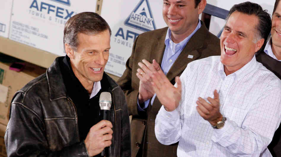 Mitt Romney gets a kick out of South Dakota Sen. John Thune's comments during a January rally in Dubuque, Iowa.