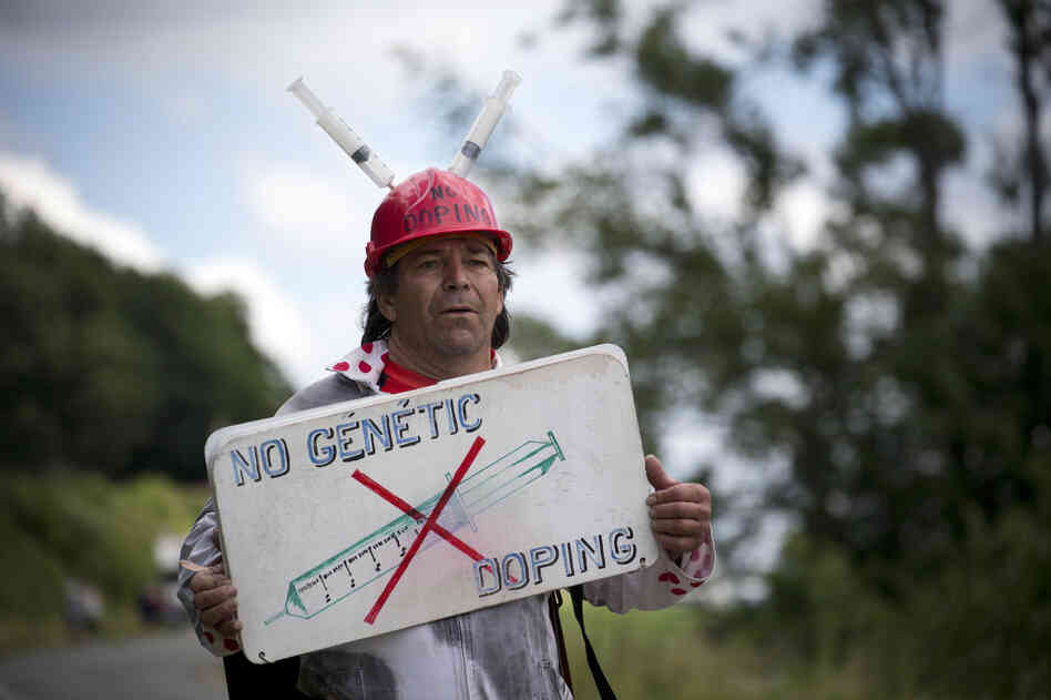An protester shares his anti-doping message during the 2012 Tour de France.