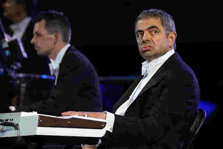 British actor Rowan Atkinson, in his role as Mr. Bean, takes part in the ceremony .