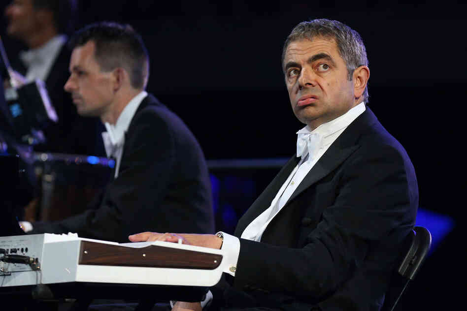 British actor Rowan Atkinson, in his role as Mr. Bean, takes part in the ceremony .