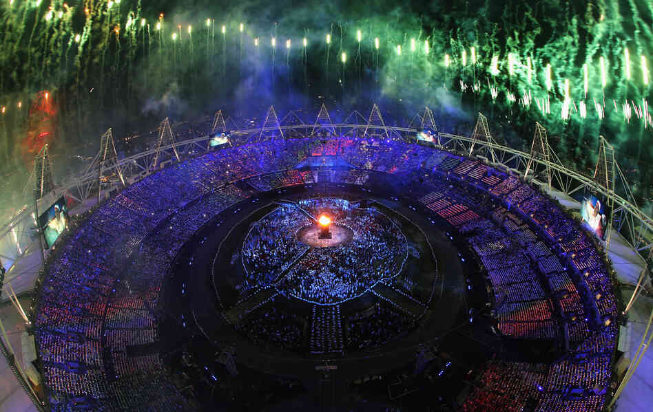 The Olympic Cauldron is lit as fireworks go off during the Opening Ceremony of the London 2012 Olympic Games at the Olympic Stadium on Friday.