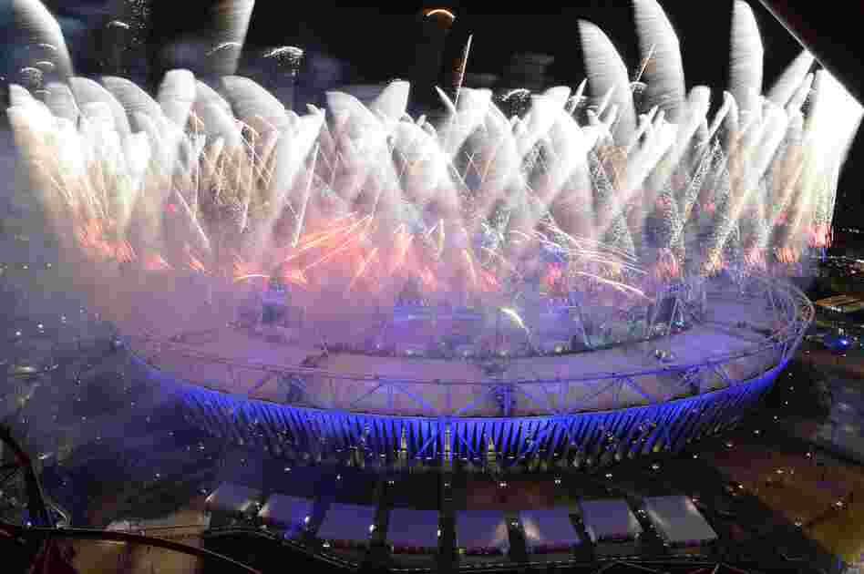 Fireworks explode from the roof of the Olympic Stadium.