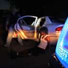 The Chicago police gang enforcement unit makes an arrest after stopping a car with four suspected gang members in June.