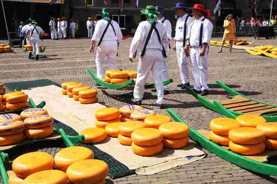 Visitors can watch cheese being "wheeled" through an outdoor market at the Dutch Cheese Museum in Alkmaar, Netherlands.