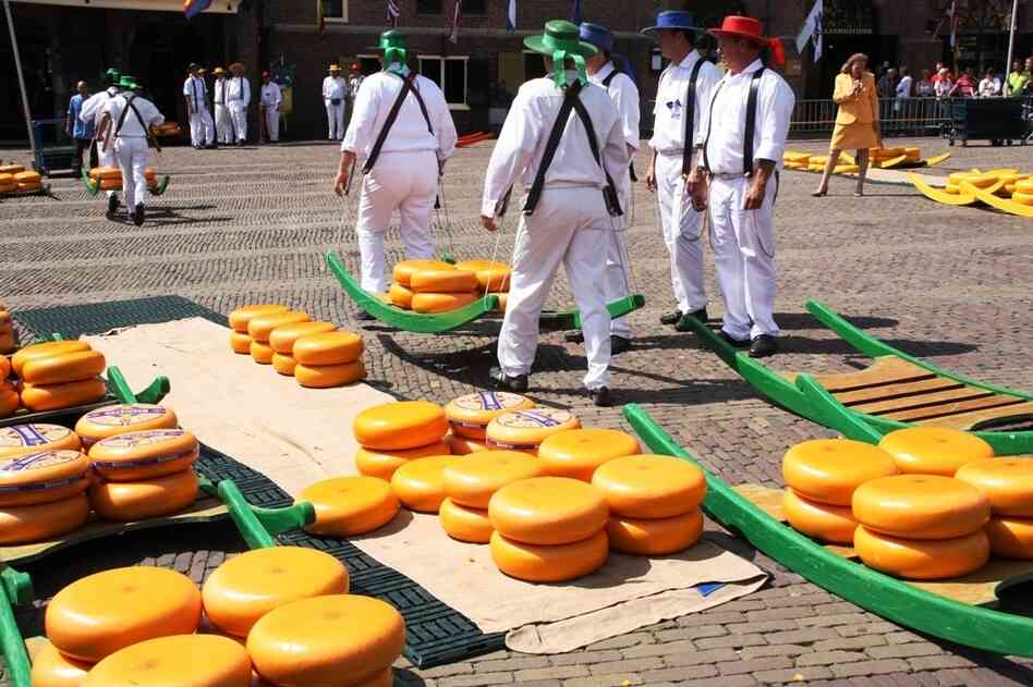 Visitors can watch cheese being "wheeled" through an outdoor market at the Dutch Cheese Museum in Alkmaar, Netherlands.